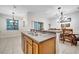 Kitchen featuring a sink, granite countertops, and pendant lighting over the dining area at 2820 Oakwater Dr # 2820, Kissimmee, FL 34747