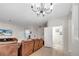 Cozy living room featuring a large sectional sofa, TV, and a glimpse into an adjacent half bathroom at 2820 Oakwater Dr # 2820, Kissimmee, FL 34747