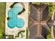 The aerial view highlights the community pool, clubhouse, and ample lounge seating at 2820 Oakwater Dr # 2820, Kissimmee, FL 34747