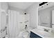 Clean and functional bathroom featuring a shower-tub combo, white tile, and updated vanity at 2850 N Powers Dr # 74, Orlando, FL 32818