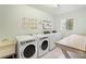 Community laundry room with multiple washers and dryers, sink, and folding table at 2850 N Powers Dr # 74, Orlando, FL 32818