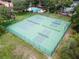 Aerial view of well-maintained tennis courts surrounded by lush greenery and mature trees at 2850 N Powers Dr # 74, Orlando, FL 32818