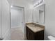 Well-lit bathroom featuring a vanity with granite countertop, modern fixtures, and a clean design at 326 Charles Dr, Deland, FL 32724