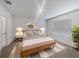Cozy bedroom with a wooden bed frame, soft lighting, and a large window for natural light at 326 Charles Dr, Deland, FL 32724