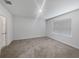 Spacious bedroom featuring plush carpeting, neutral walls, and ample natural light at 326 Charles Dr, Deland, FL 32724