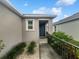 Charming home entrance featuring well-maintained landscaping, a welcoming walkway, and stylish exterior accents at 326 Charles Dr, Deland, FL 32724