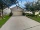 Charming one-story home featuring a two-car garage, neutral exterior, and well-maintained landscaping at 326 Charles Dr, Deland, FL 32724