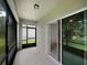 Screened lanai offering a relaxing outdoor space with a view of the backyard at 326 Charles Dr, Deland, FL 32724