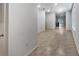 Open living space with tile floors, leading to the kitchen, and rooms, offering versatile layout options at 326 Charles Dr, Deland, FL 32724