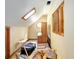 Attic with natural light coming in through a window and a skylight at 3580 Ne 160Th Ln, Citra, FL 32113