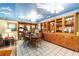 Unique dining room with a mural ceiling, classic wood cabinets and a tile floor at 3580 Ne 160Th Ln, Citra, FL 32113