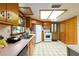 Bright kitchen features wood cabinets, white appliances, and a window over the sink at 3580 Ne 160Th Ln, Citra, FL 32113
