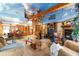 Open concept living room and dining area with spiral staircase and cloud-themed ceiling at 3580 Ne 160Th Ln, Citra, FL 32113