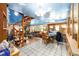Open concept living room with spiral staircase and cloud-themed ceiling at 3580 Ne 160Th Ln, Citra, FL 32113