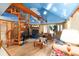 Open concept living room with spiral staircase, fireplace, and unique ceiling at 3580 Ne 160Th Ln, Citra, FL 32113