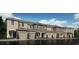 Row of newly constructed modern townhomes with individual garages and professional landscaping at 3603 Davenport Creek Ct, Kissimmee, FL 34746