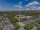 An aerial view of a neighborhood featuring townhomes and lush greenery at 3798 Lower Union Rd, Orlando, FL 32814