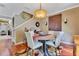 Cozy dining area with a round table, comfortable chairs, and warm lighting at 3798 Lower Union Rd, Orlando, FL 32814