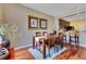 Inviting dining room featuring a wooden table, comfortable seating, and hardwood floors with a dining bar at 3798 Lower Union Rd, Orlando, FL 32814