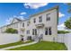 Townhouse featuring a well-maintained lawn, white fence and a charming walkway at 3798 Lower Union Rd, Orlando, FL 32814