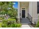 View of the front door with landscaping and a staircase leading up to the entrance at 3798 Lower Union Rd, Orlando, FL 32814