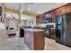 Well-equipped kitchen with an island, black appliances, and dark wood cabinetry at 3798 Lower Union Rd, Orlando, FL 32814
