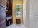 Kitchen nook area featuring a built-in desk with cabinets, a window with natural light, and a small table at 3798 Lower Union Rd, Orlando, FL 32814