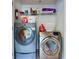 Washer and dryer in a tidy laundry room with storage shelves and a fire extinguisher at 3798 Lower Union Rd, Orlando, FL 32814