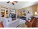 Living room boasts a fireplace, hardwood floors, comfortable seating, and bright natural light at 3798 Lower Union Rd, Orlando, FL 32814