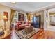 Comfortable living room with hardwood floors, a stylish sofa, and elegant furnishings at 3798 Lower Union Rd, Orlando, FL 32814
