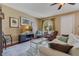 Cozy living room features hardwood floors, comfortable furniture, a ceiling fan, and natural light at 3798 Lower Union Rd, Orlando, FL 32814
