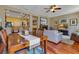 Open-concept living space with a dining table, comfortable seating, and a cozy fireplace at 3798 Lower Union Rd, Orlando, FL 32814