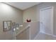 Bright staircase with neutral walls, white trim, decorative mirrors, and red bird statues add a touch of elegance at 3798 Lower Union Rd, Orlando, FL 32814