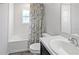 Clean bathroom featuring a tub-shower combination, bright lighting, and a modern vanity for a refreshing experience at 394 Pentas Ln, Haines City, FL 33844