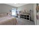 Bright bedroom with a comfortable bed, cozy desk area, and ample storage, ideal for relaxation and productivity at 394 Pentas Ln, Haines City, FL 33844