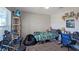 Comfortable bedroom featuring a bed, desk, and storage, perfect for students or anyone needing a quiet retreat at 394 Pentas Ln, Haines City, FL 33844