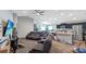 Open-concept living area with modern recessed lighting, seamlessly flowing into the dining and kitchen spaces at 394 Pentas Ln, Haines City, FL 33844