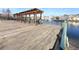 Community dock offers seating and shaded pergola with water view of community at 4019 Venetian Bay Dr # 107, Kissimmee, FL 34741