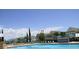 Community pool with comfortable seating and umbrellas, offering a refreshing experience for residents at 4019 Venetian Bay Dr # 107, Kissimmee, FL 34741