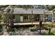 Expansive backyard featuring a large deck, green space, and mature trees at 42108 Pine Valley Dr, Paisley, FL 32767