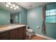 Bathroom featuring tiled floors, a vanity sink, and large mirror at 42108 Pine Valley Dr, Paisley, FL 32767
