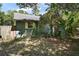 A view of the side of a charming home with lush surrounding foliage at 42108 Pine Valley Dr, Paisley, FL 32767