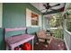 Inviting covered porch with bench swing and charming decor at 42108 Pine Valley Dr, Paisley, FL 32767