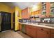 Bright kitchen with stainless steel appliances, light counter tops, tiled backsplash, and ample cabinet space at 42108 Pine Valley Dr, Paisley, FL 32767