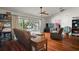 Bright living room with hardwood floors, large sliding door and comfortable seating at 42108 Pine Valley Dr, Paisley, FL 32767