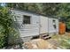 Outdoor shed with access steps, ideal for storage or a workshop space at 42108 Pine Valley Dr, Paisley, FL 32767