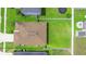 Aerial view of a home with a large, fenced backyard and mature landscaping at 4529 Orchard Grove Rd, St Cloud, FL 34772