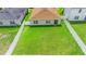 Aerial view of a spacious backyard with a full white vinyl fence at 4529 Orchard Grove Rd, St Cloud, FL 34772