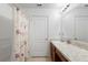 Bathroom featuring a single sink vanity with a tile countertop and a shower/tub combo at 4529 Orchard Grove Rd, St Cloud, FL 34772