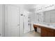 Bathroom featuring a single sink vanity with a tile countertop and a glass door shower at 4529 Orchard Grove Rd, St Cloud, FL 34772